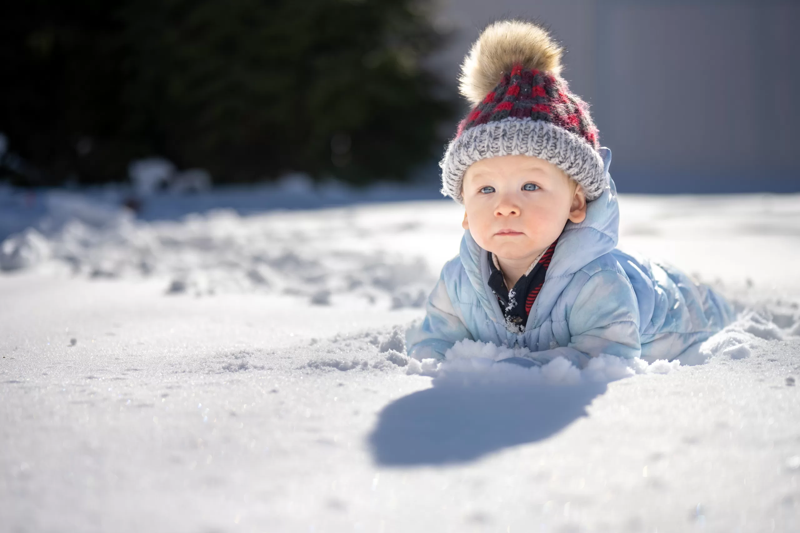 baby laying in the snow Winter Activities for Babies